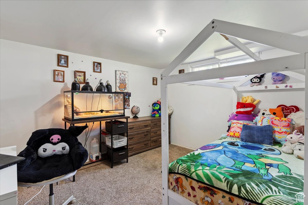 Bedroom with carpet and vaulted ceiling