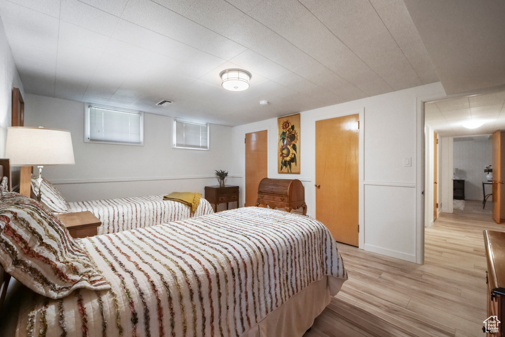 Bedroom with light wood-style flooring