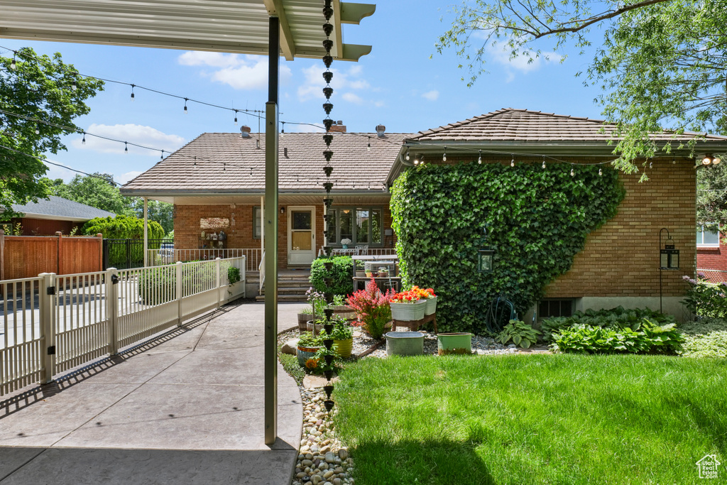 View of front of home with covered porch and brick siding