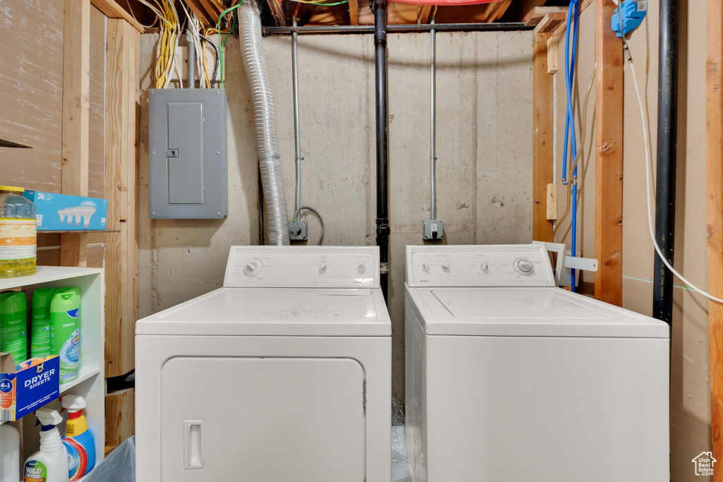 Laundry room featuring washer and clothes dryer and electric panel
