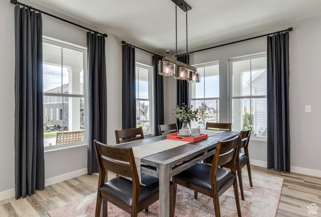 Dining space featuring light wood finished floors and baseboards