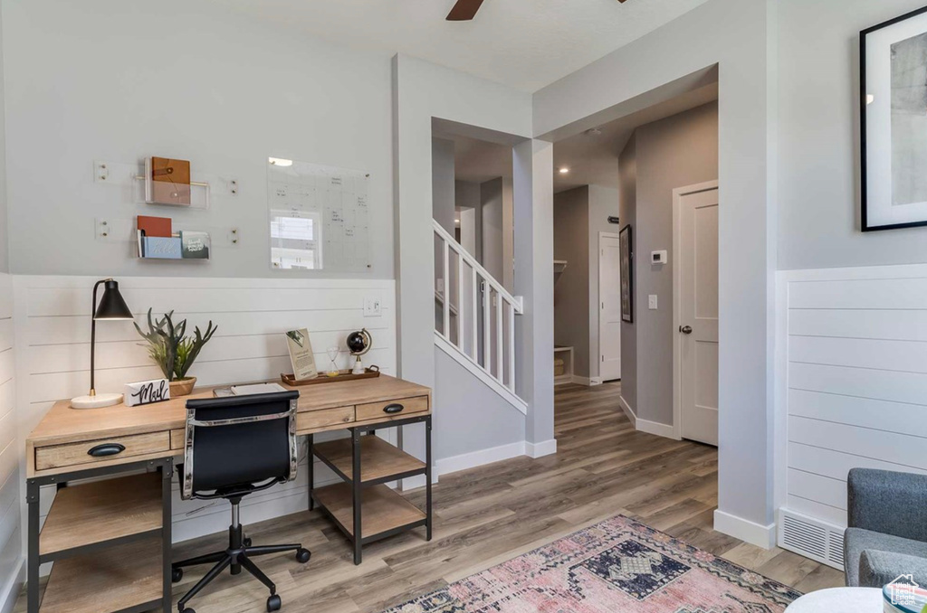 Office area featuring wood finished floors and a ceiling fan