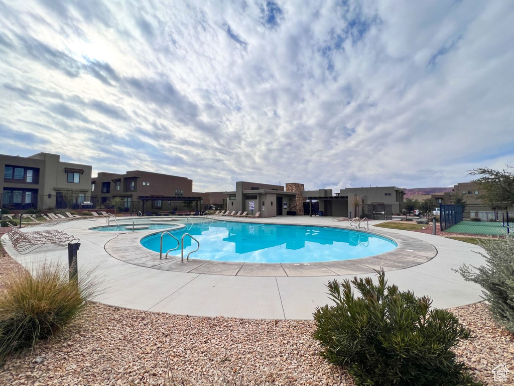 Community pool with a residential view