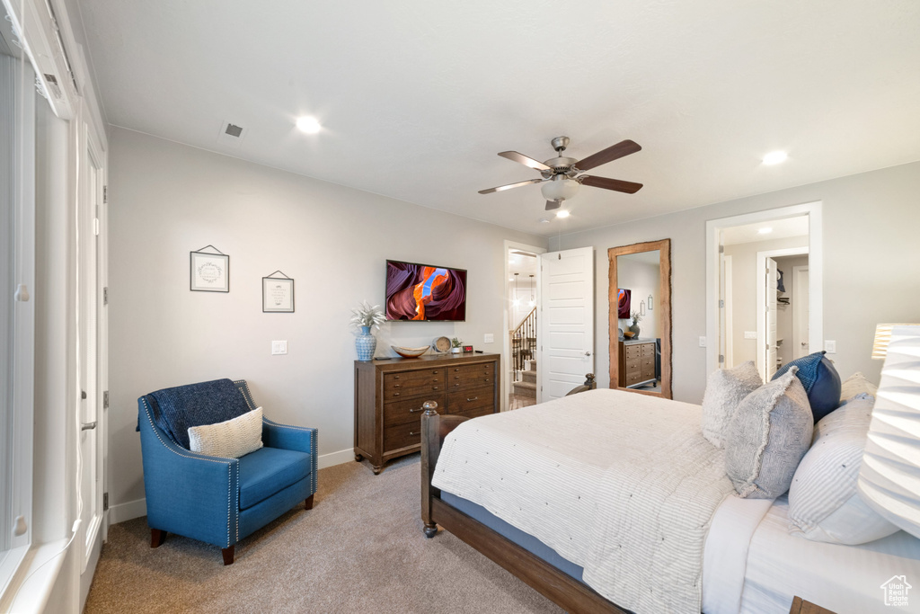 Bedroom featuring recessed lighting, light colored carpet, baseboards, and ceiling fan