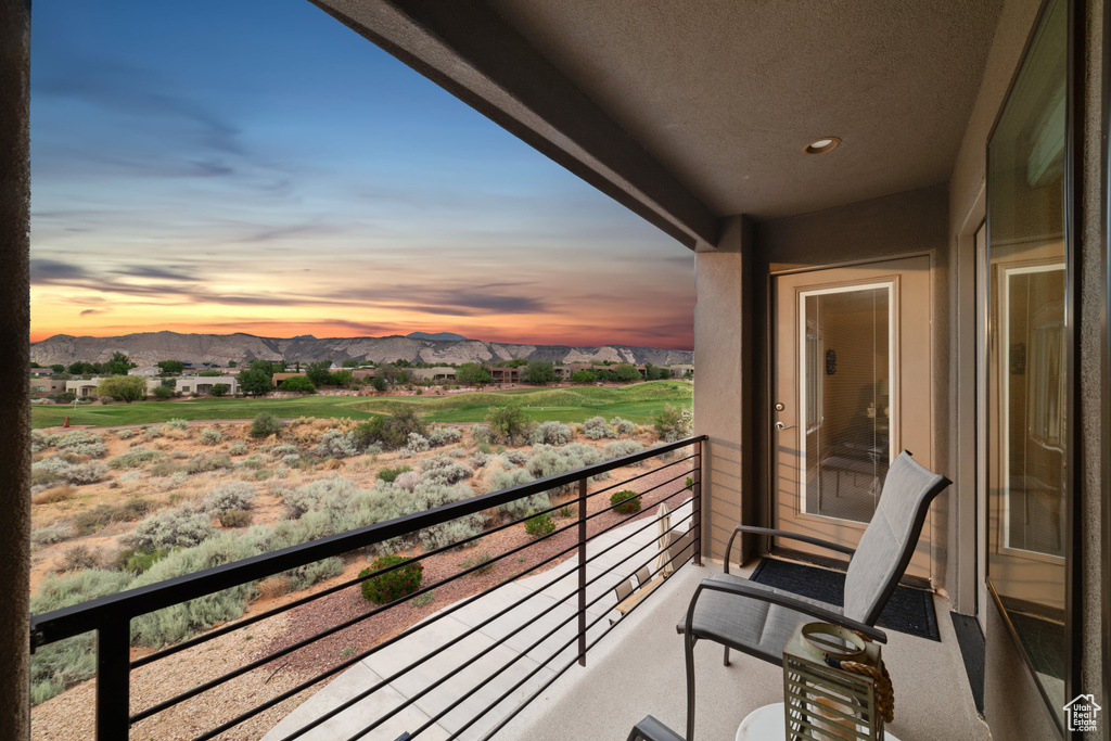 Balcony at dusk with a mountain view
