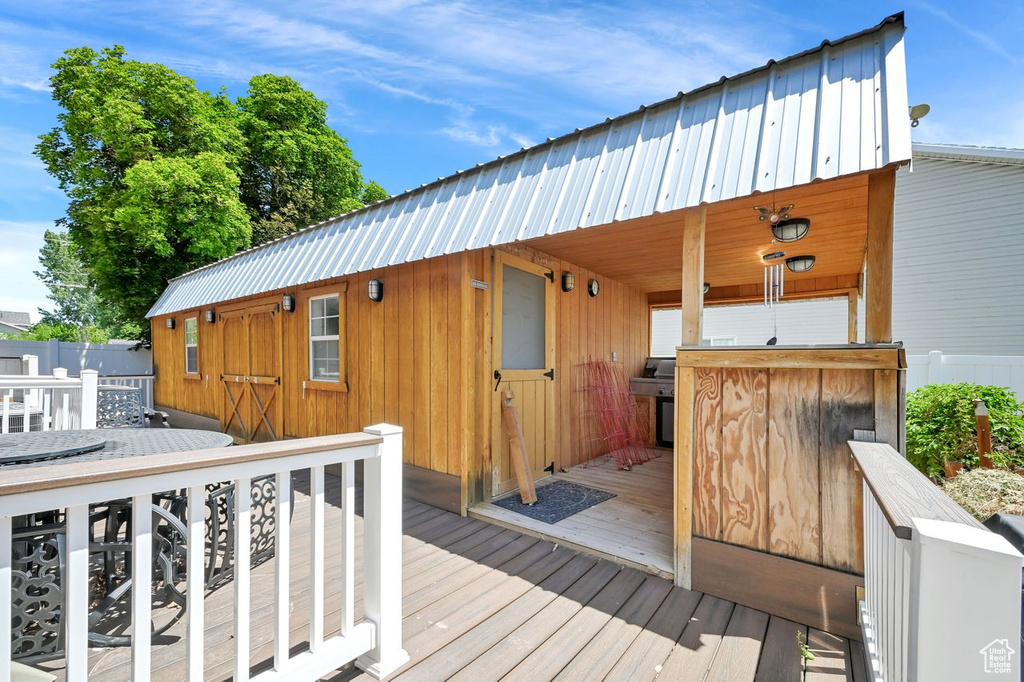 Wooden deck featuring outdoor dining area