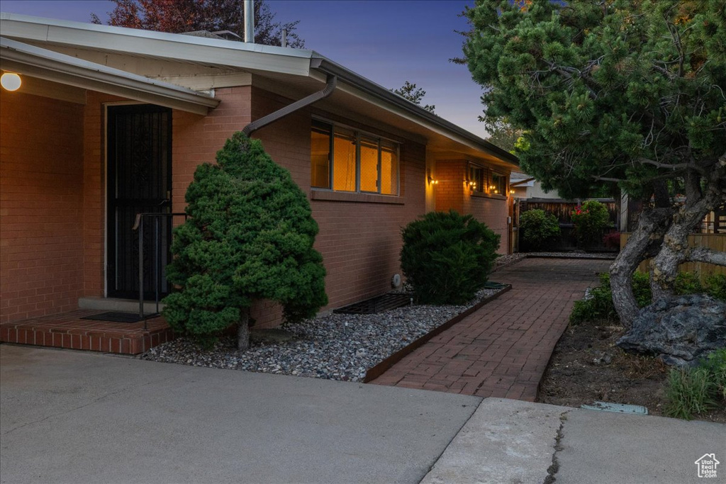 View of side of property featuring brick siding