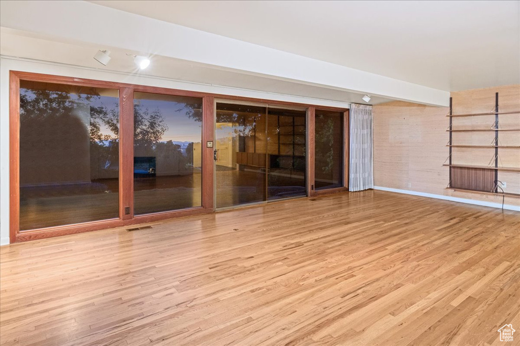 Spare room with wood finished floors