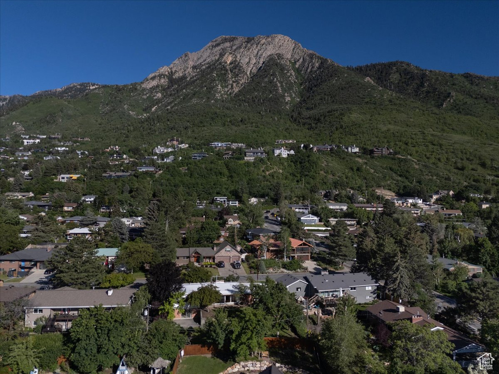 View of mountain backdrop featuring nearby suburban area