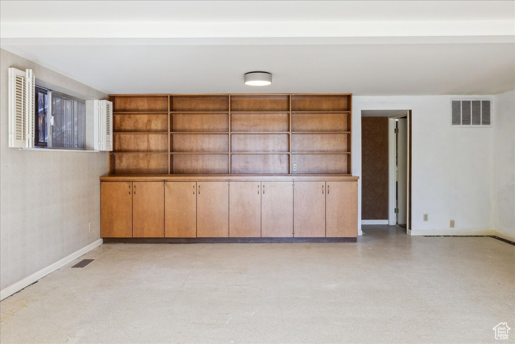 Empty room featuring baseboards