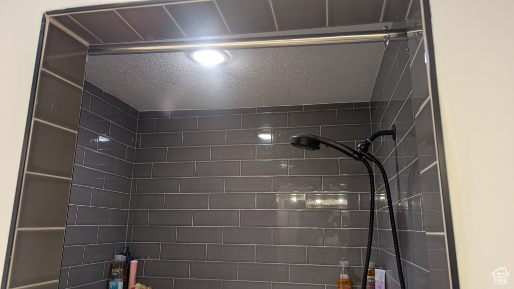 Bathroom view of a tile shower