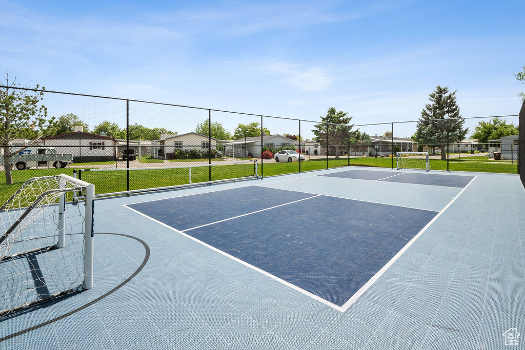 View of basketball court with community basketball court and a residential view