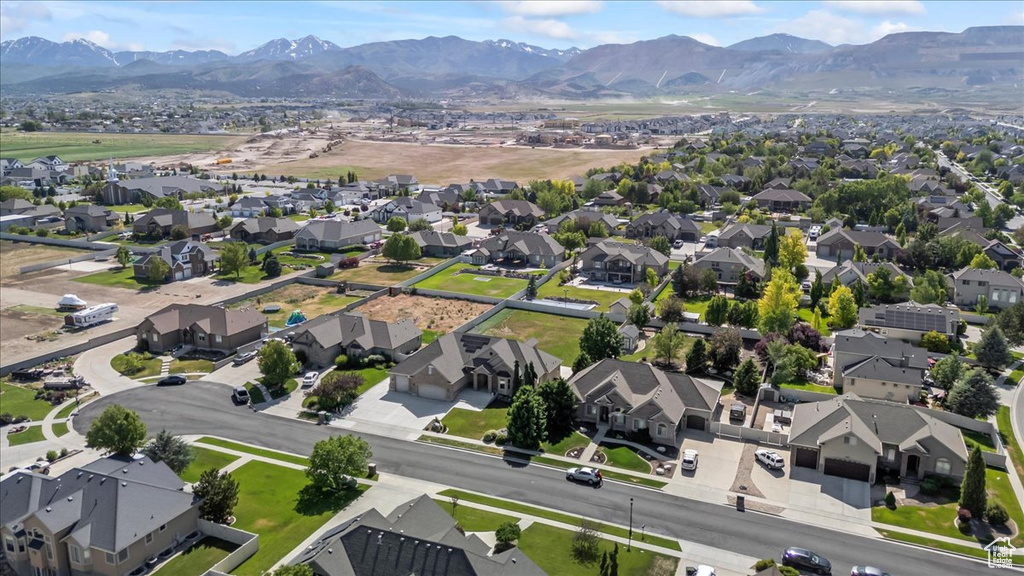 View of property location with a mountain backdrop and nearby suburban area