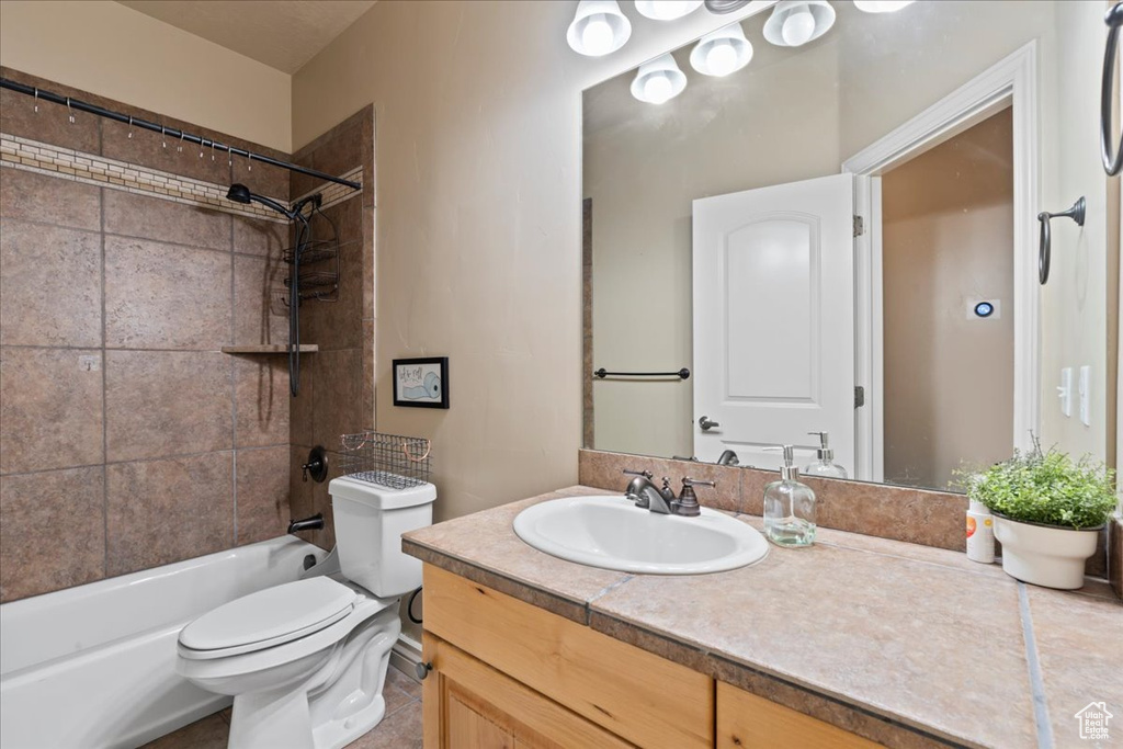 Full bathroom with vanity, toilet, and shower / washtub combination