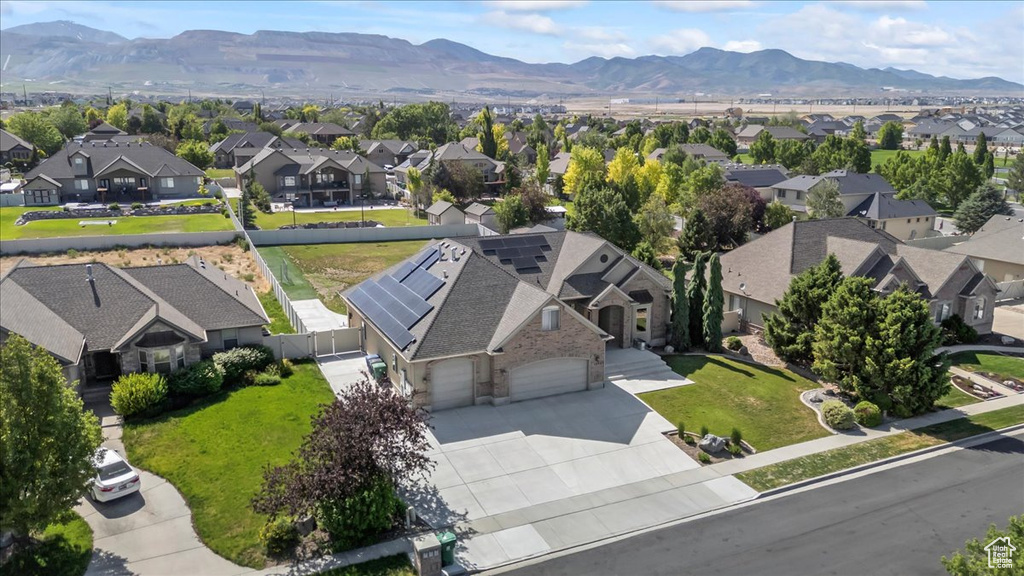 Aerial view of residential area featuring mountains