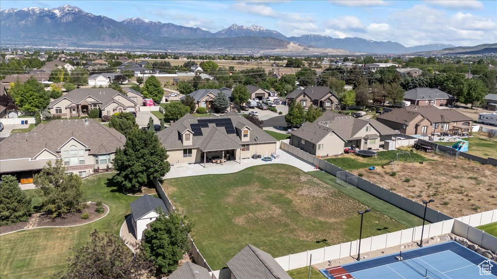 Aerial view of residential area featuring a mountainous background