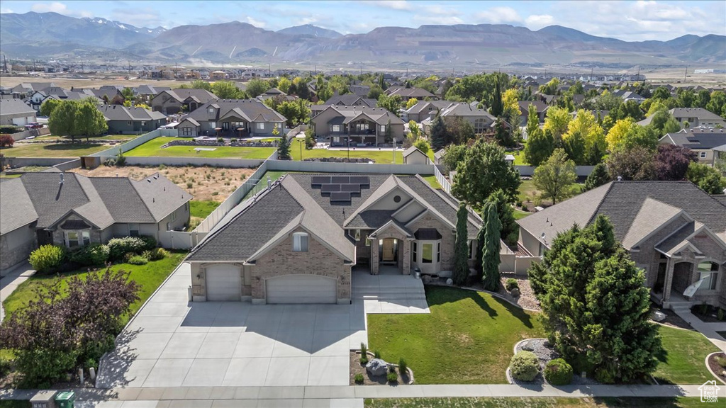 Aerial perspective of suburban area featuring a mountain backdrop