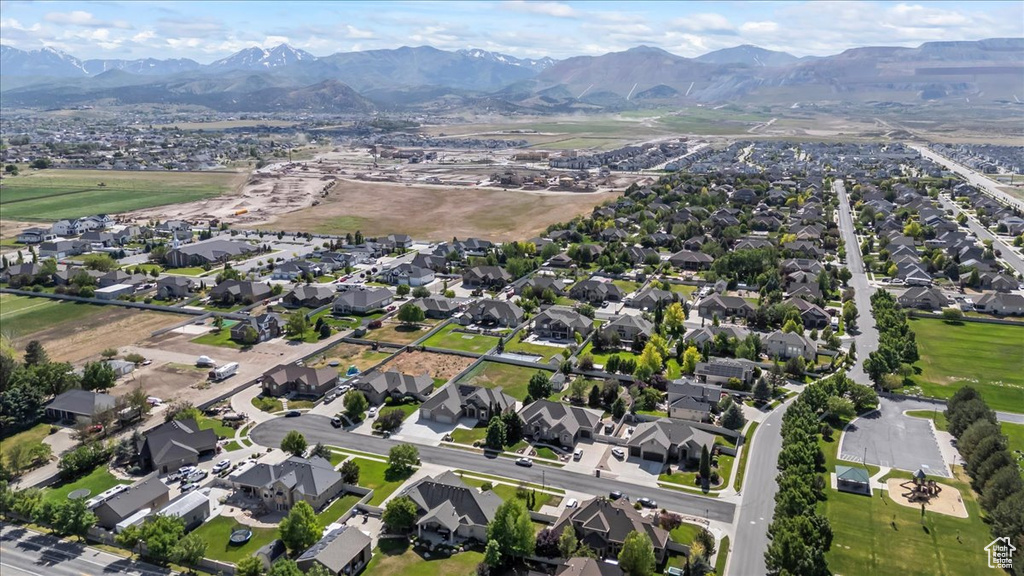 View of property location with a mountain backdrop and nearby suburban area