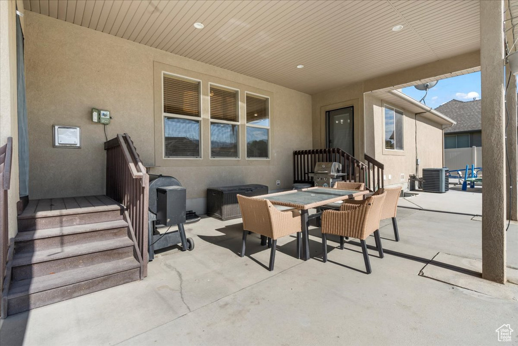 View of patio / terrace featuring outdoor dining space and central air condition unit