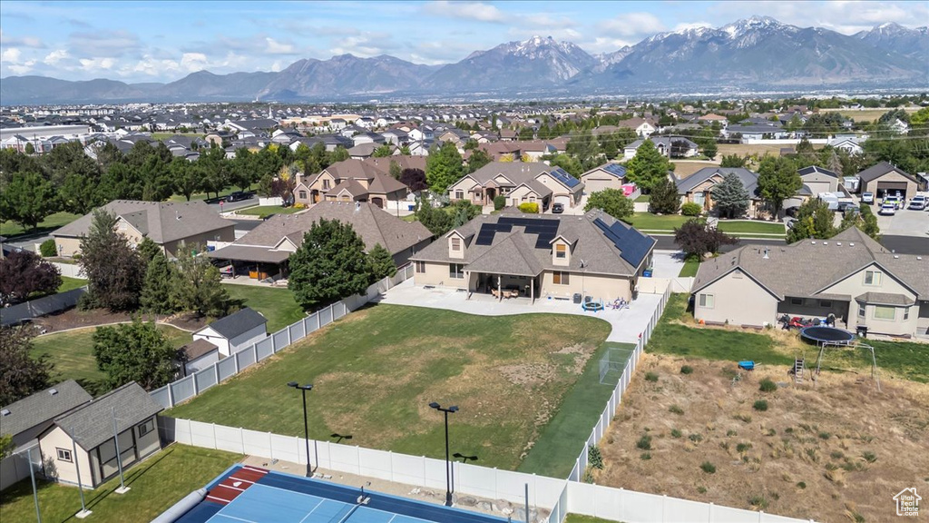 Aerial view of residential area featuring mountains
