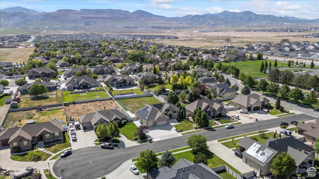 Aerial overview of property\'s location with nearby suburban area and mountains