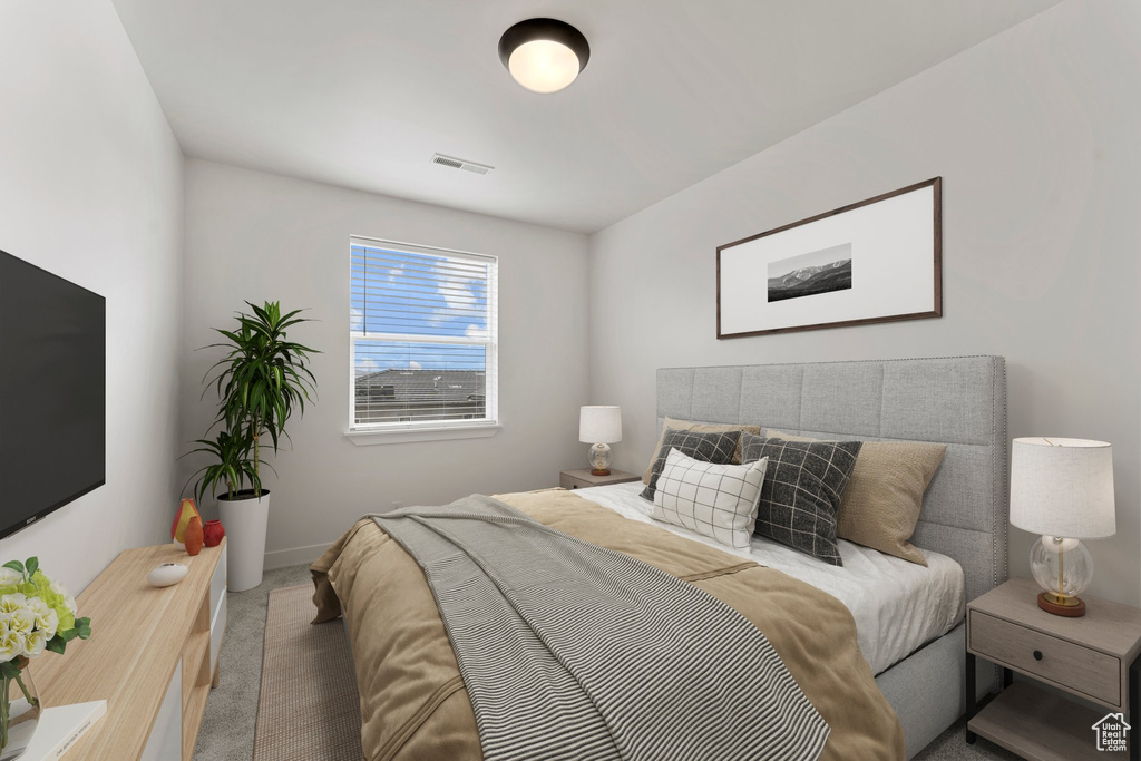 Carpeted bedroom with baseboards