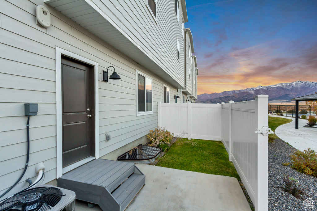 View of patio / terrace with a mountain view and cooling unit