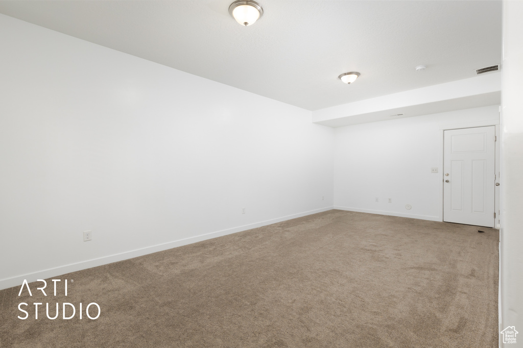 Unfurnished room featuring carpet flooring and baseboards