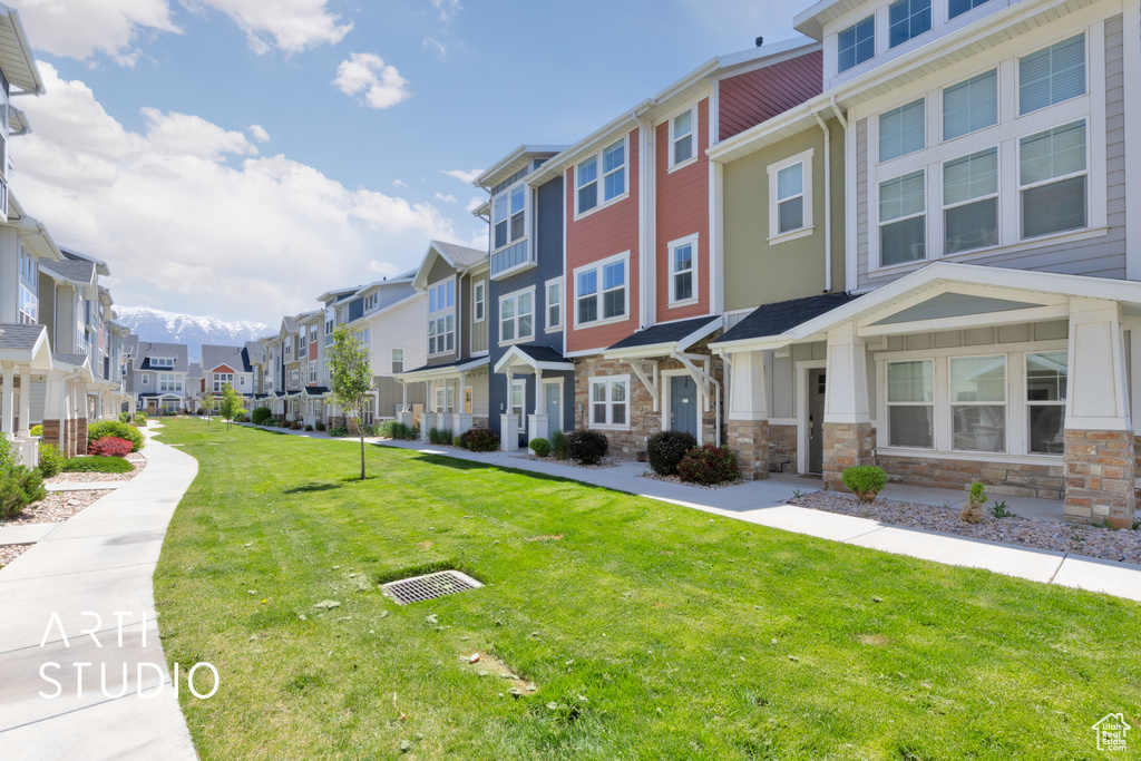 View of home\'s community featuring a residential view and a lawn