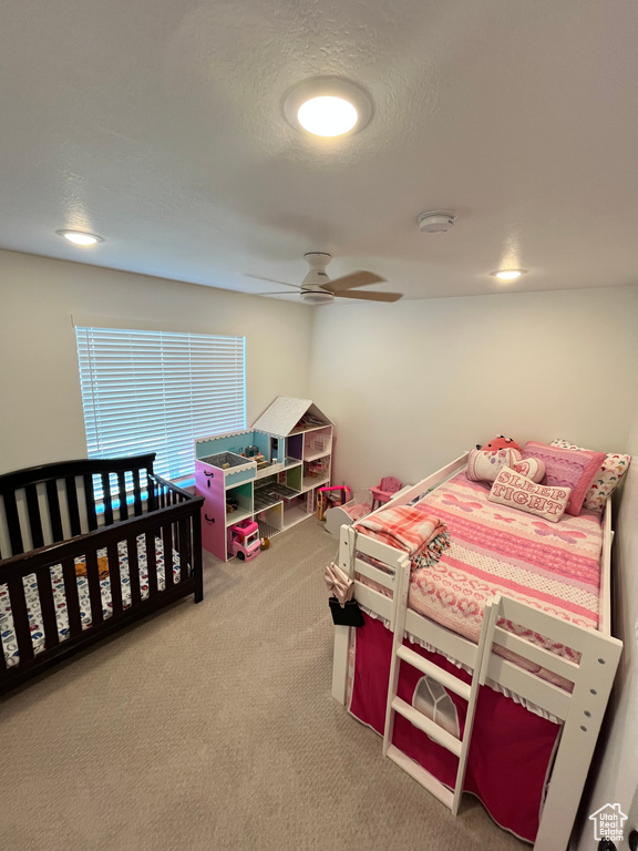 Bedroom featuring carpet flooring and ceiling fan