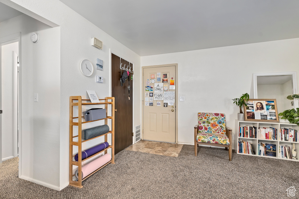 Living area featuring carpet floors