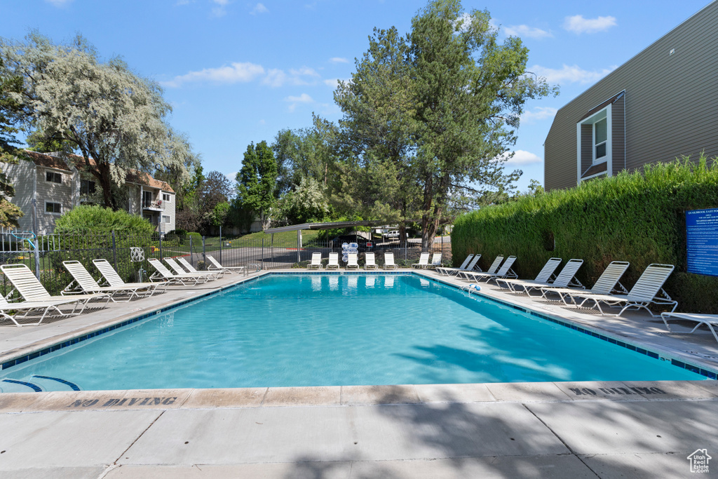 Community pool with a patio area