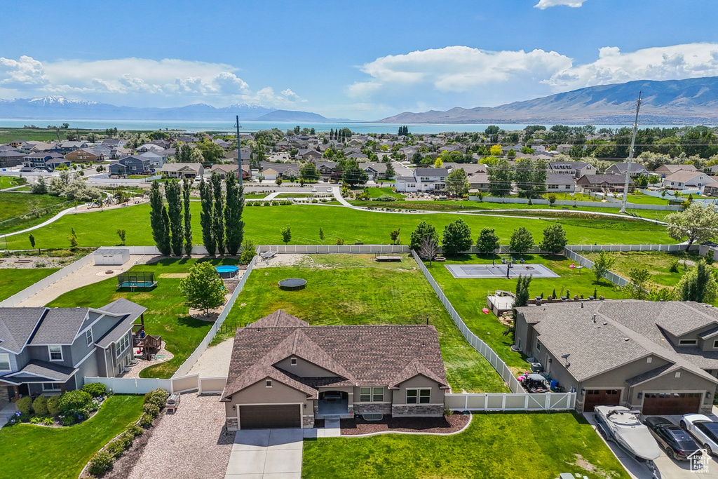 Aerial perspective of suburban area featuring a mountainous background