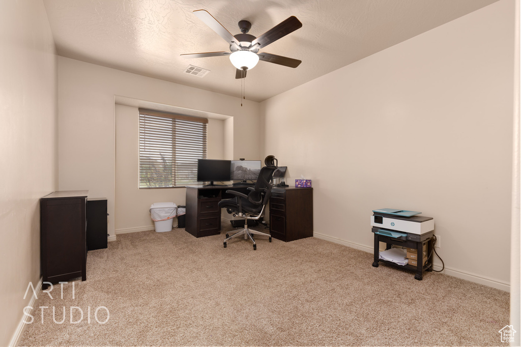 Office with carpet, ceiling fan, and baseboards