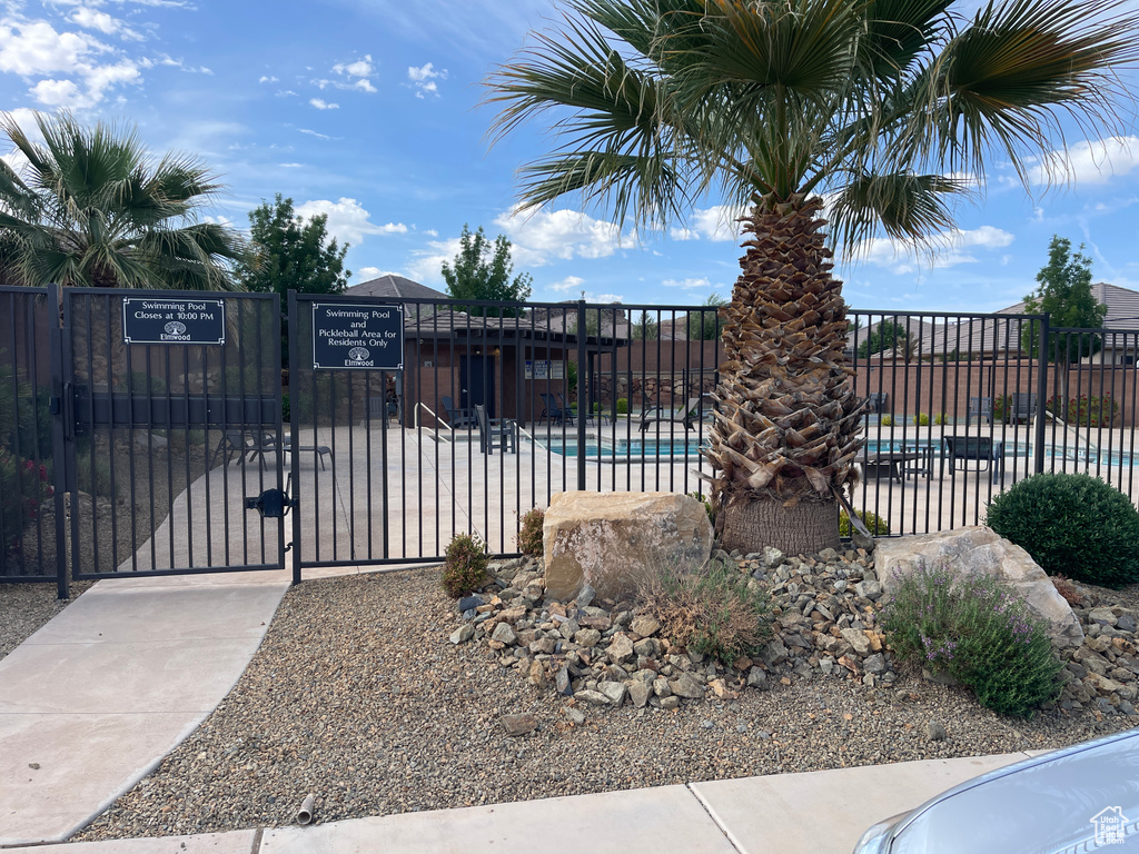 View of pool featuring a gate