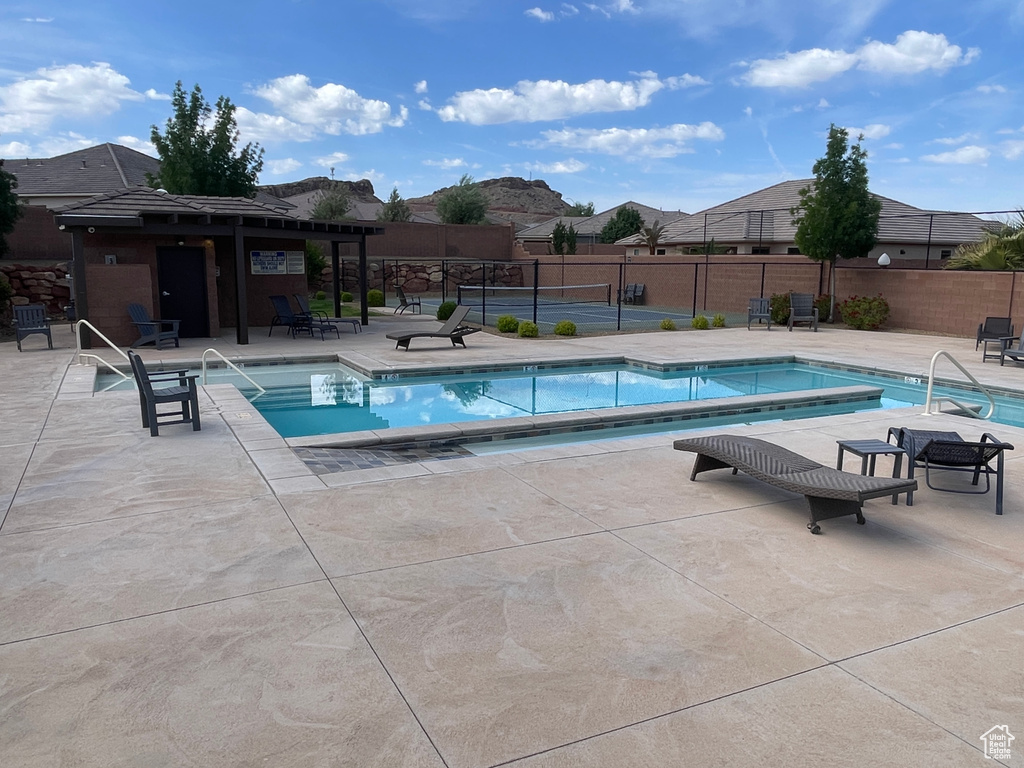 Community pool with a patio