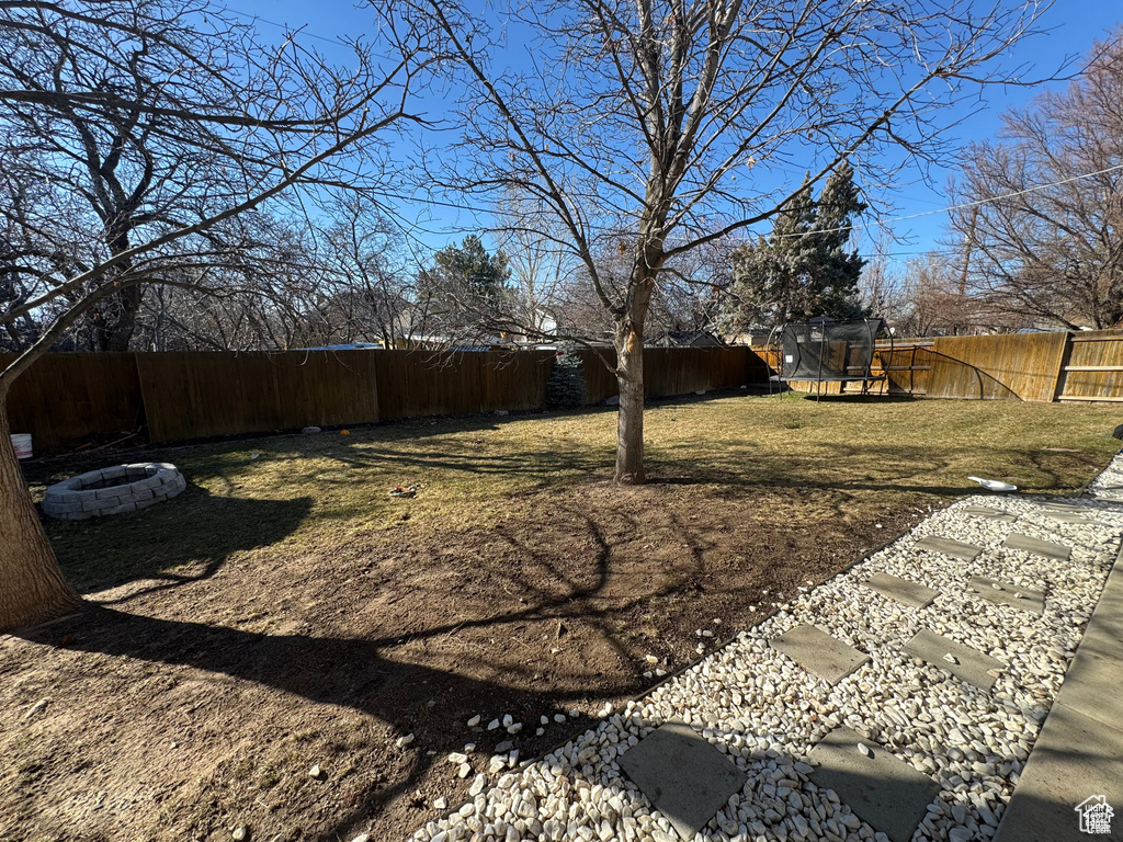 View of yard featuring a trampoline