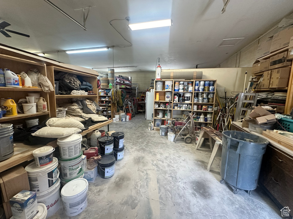Garage with freestanding refrigerator and a workshop area