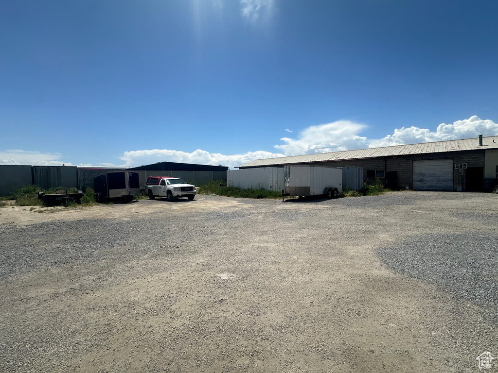 View of front of house with gravel driveway