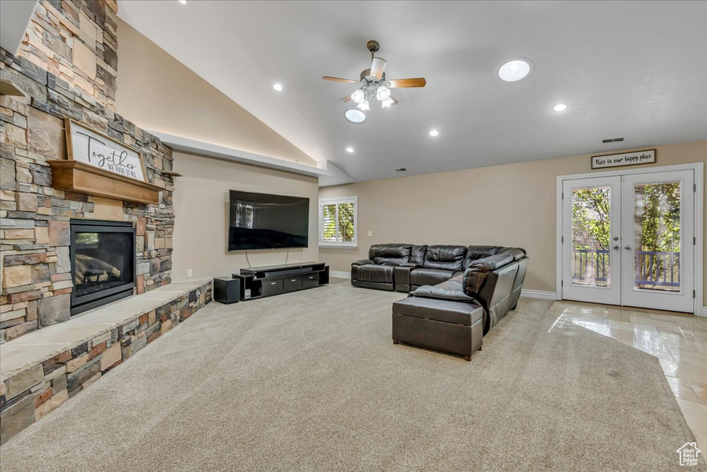 Living area with ceiling fan, lofted ceiling, a fireplace, recessed lighting, and baseboards