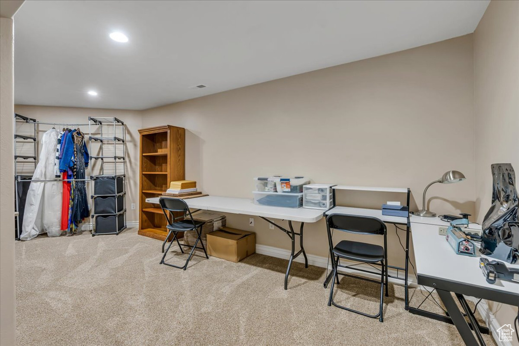 Carpeted home office featuring baseboards and recessed lighting
