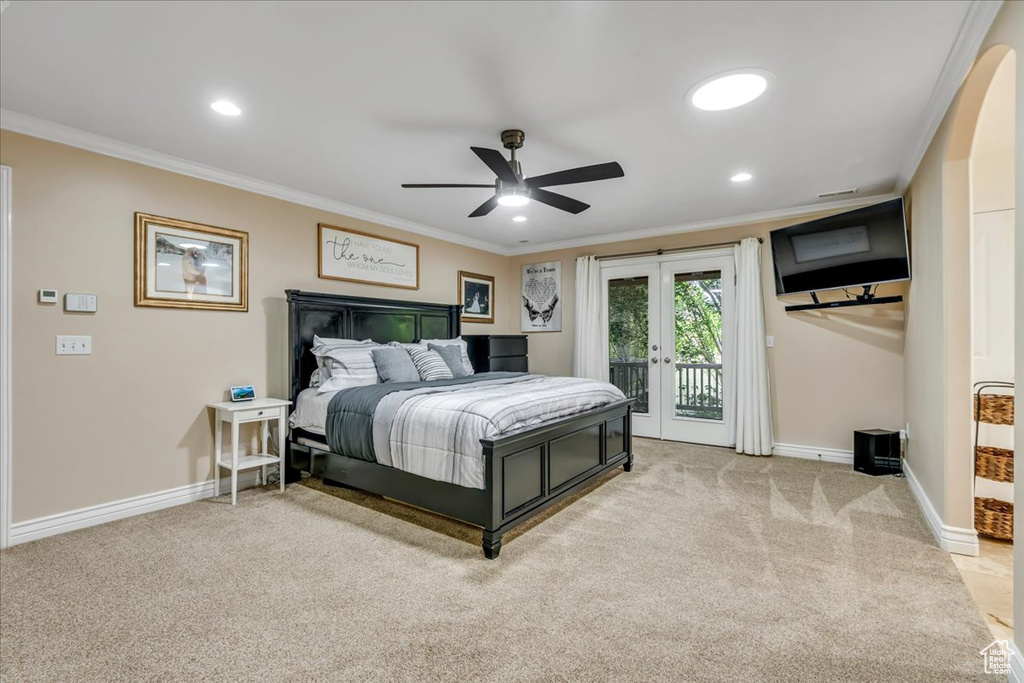 Bedroom featuring access to exterior, crown molding, baseboards, light carpet, and recessed lighting