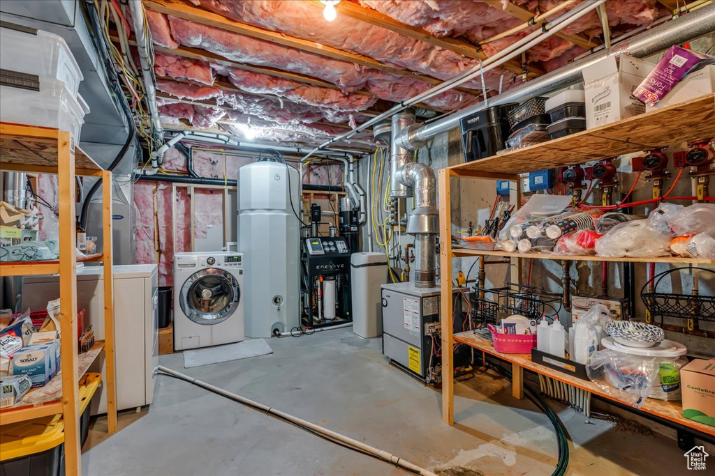 Unfinished basement with washing machine and dryer