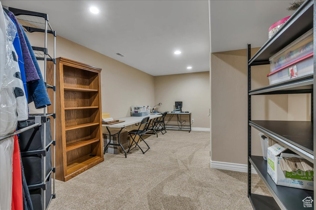 Carpeted office with recessed lighting and baseboards