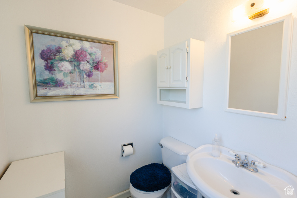 Bathroom featuring toilet and a sink