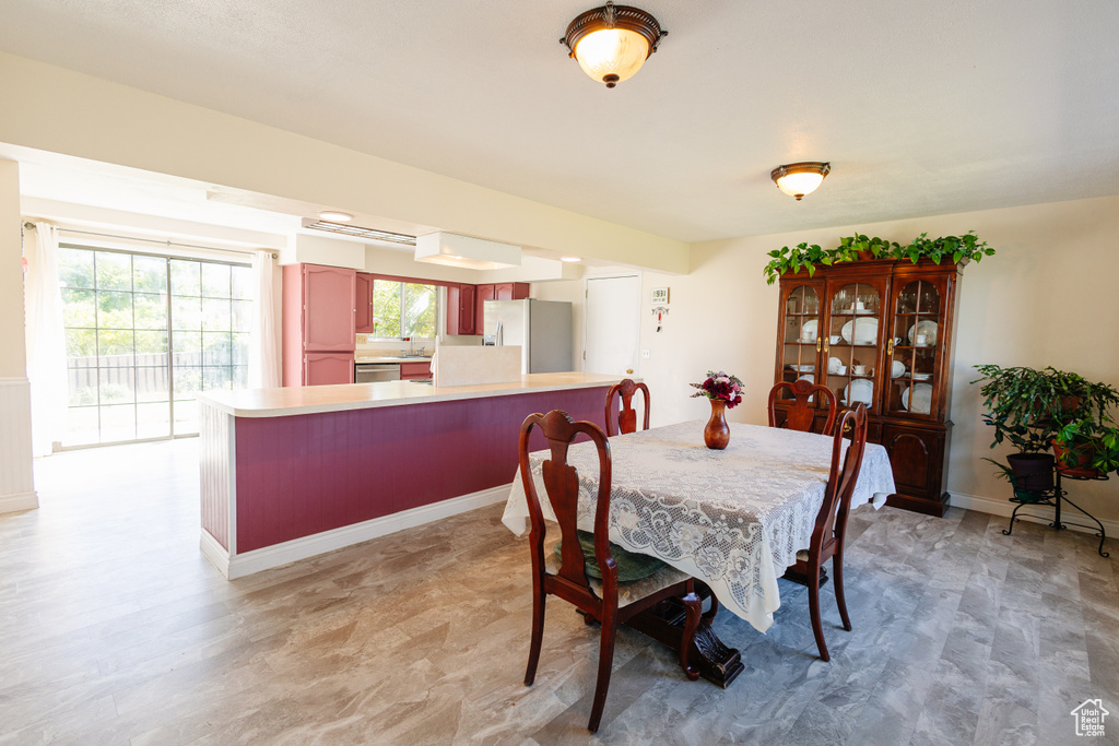 Dining area with healthy amount of natural light and baseboards
