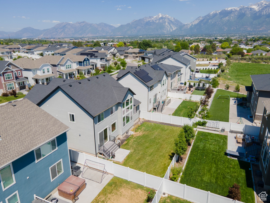 Aerial perspective of suburban area with a mountainous background