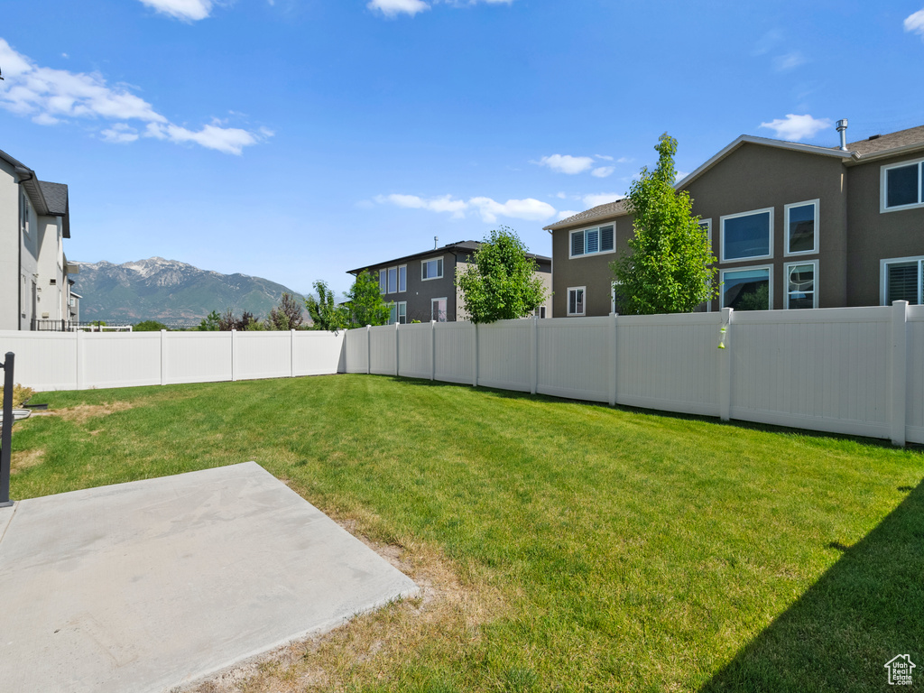 View of yard featuring a patio and a mountain view
