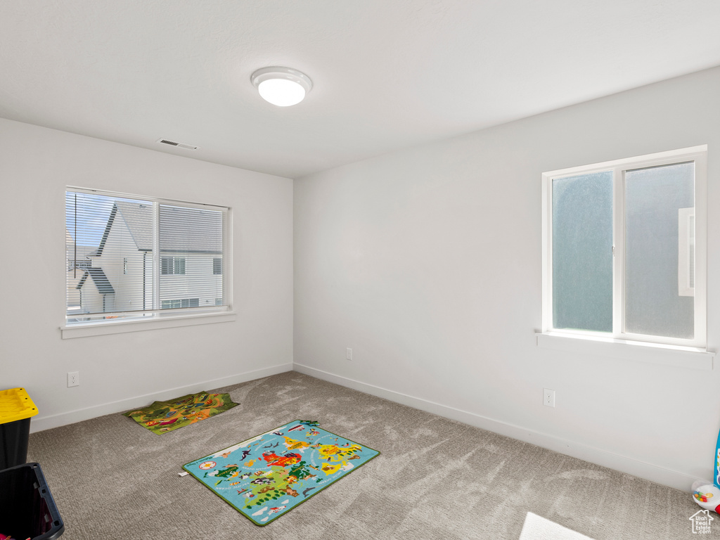 Playroom featuring carpet and baseboards