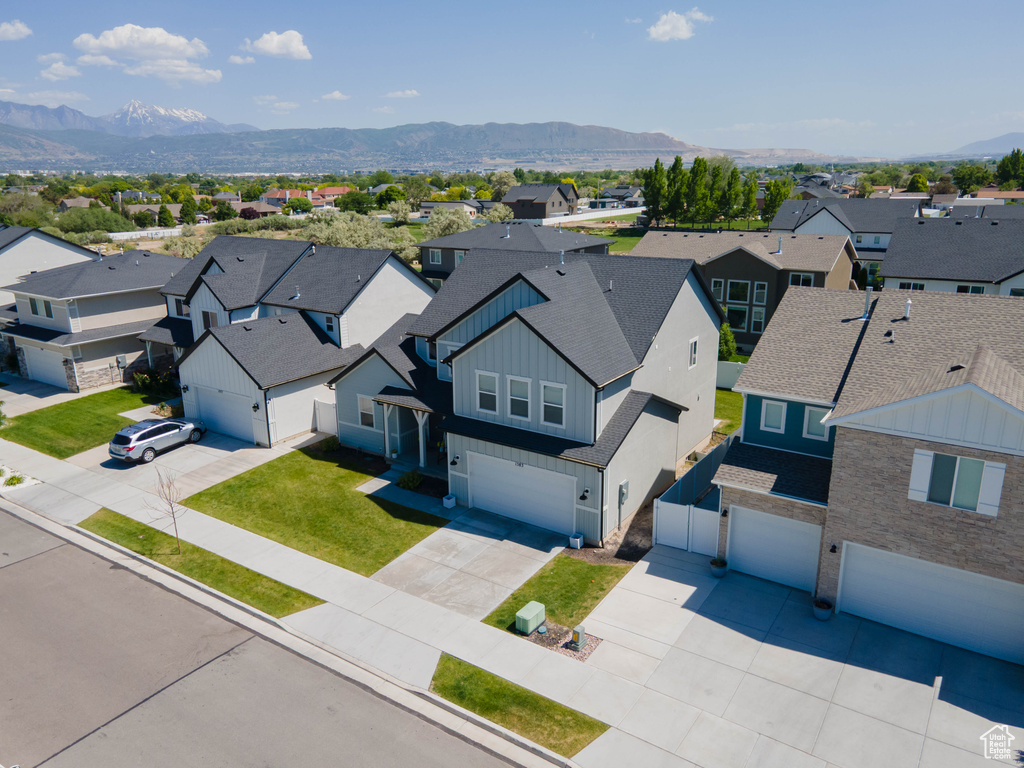 Aerial perspective of suburban area featuring a mountain backdrop